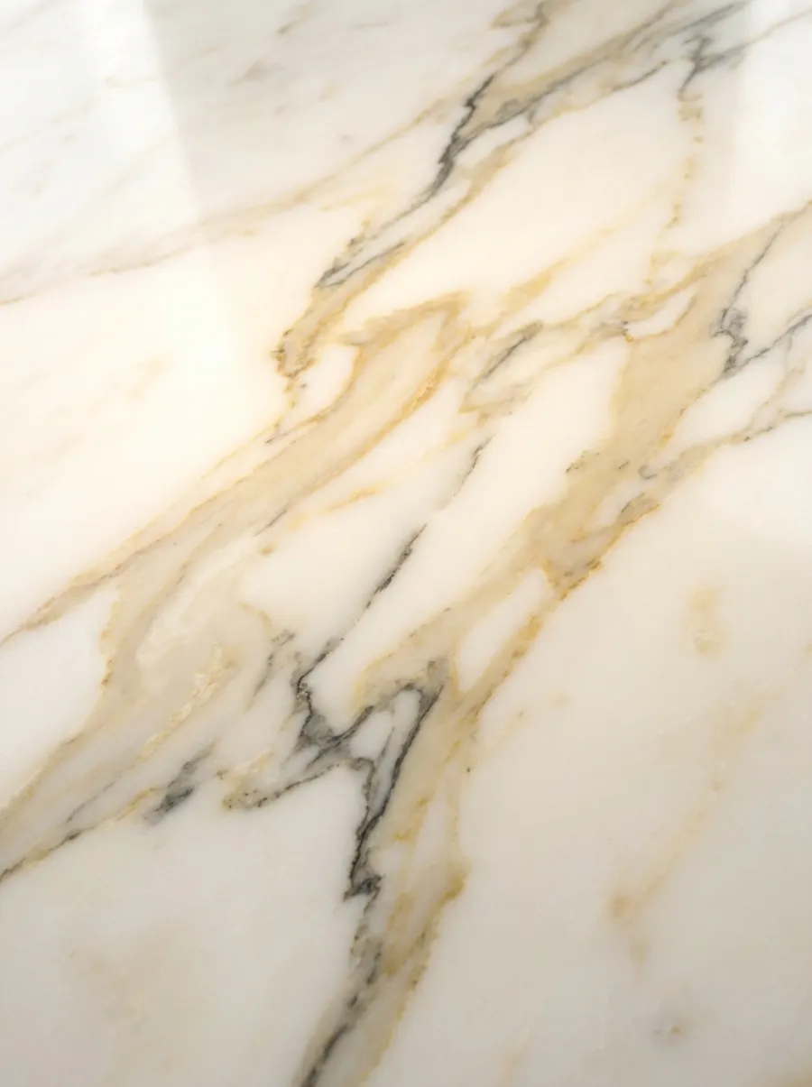 White marble slab with soft grey and gold veining