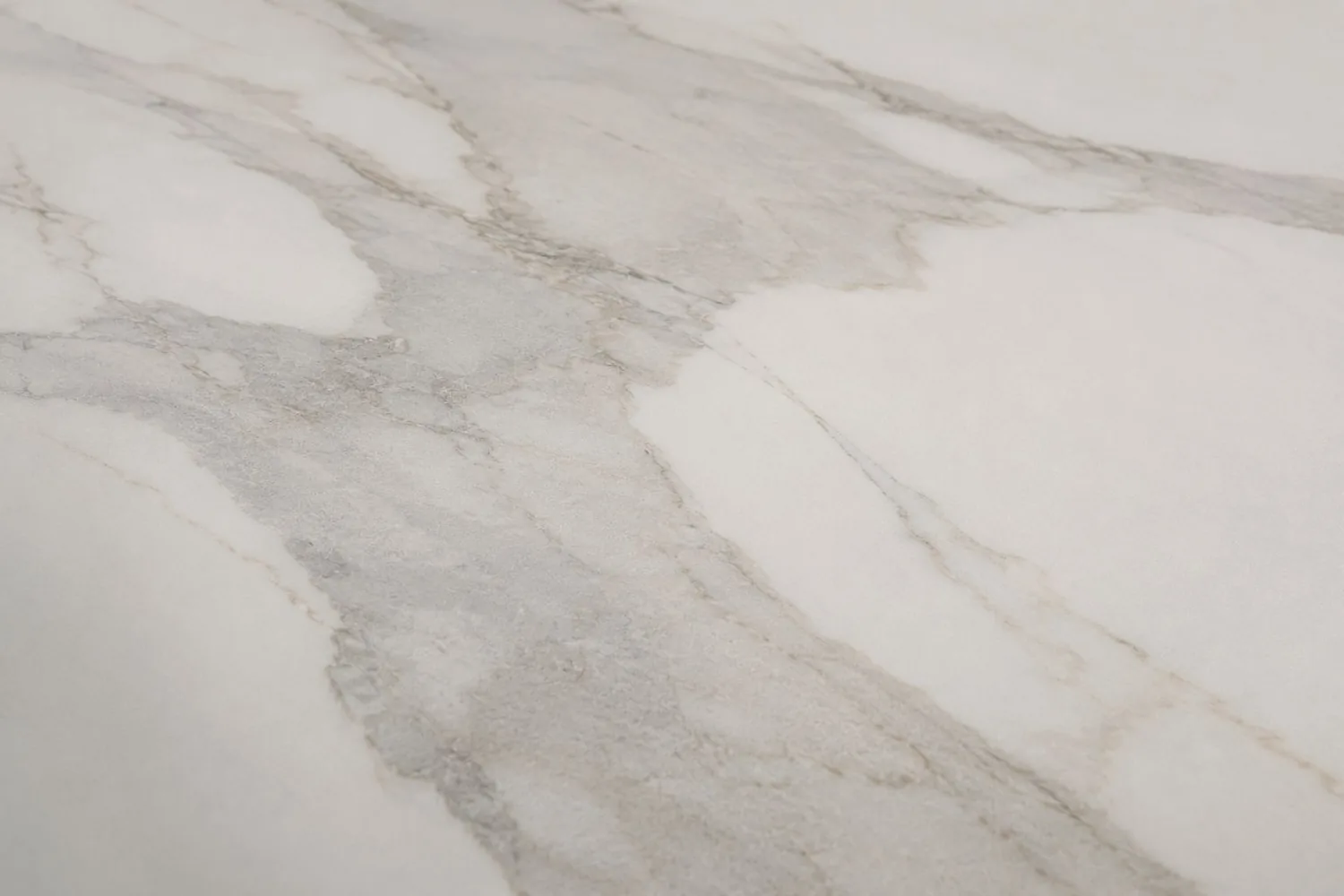 Large-format porcelain slab in soft white marble effect