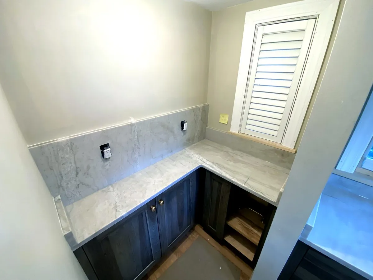 Bright corner kitchen in marble